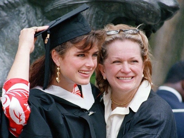 Teri Shields with Brooke Shields in black and white academical dress.